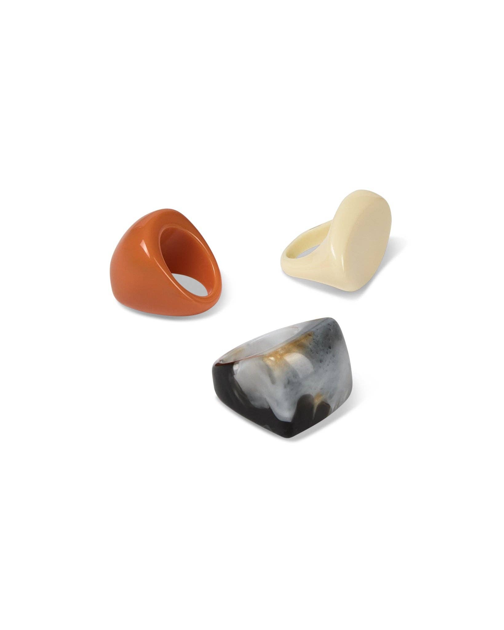 Three unique ring designs on a white background