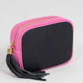pink and navy crossbody bag with tassel