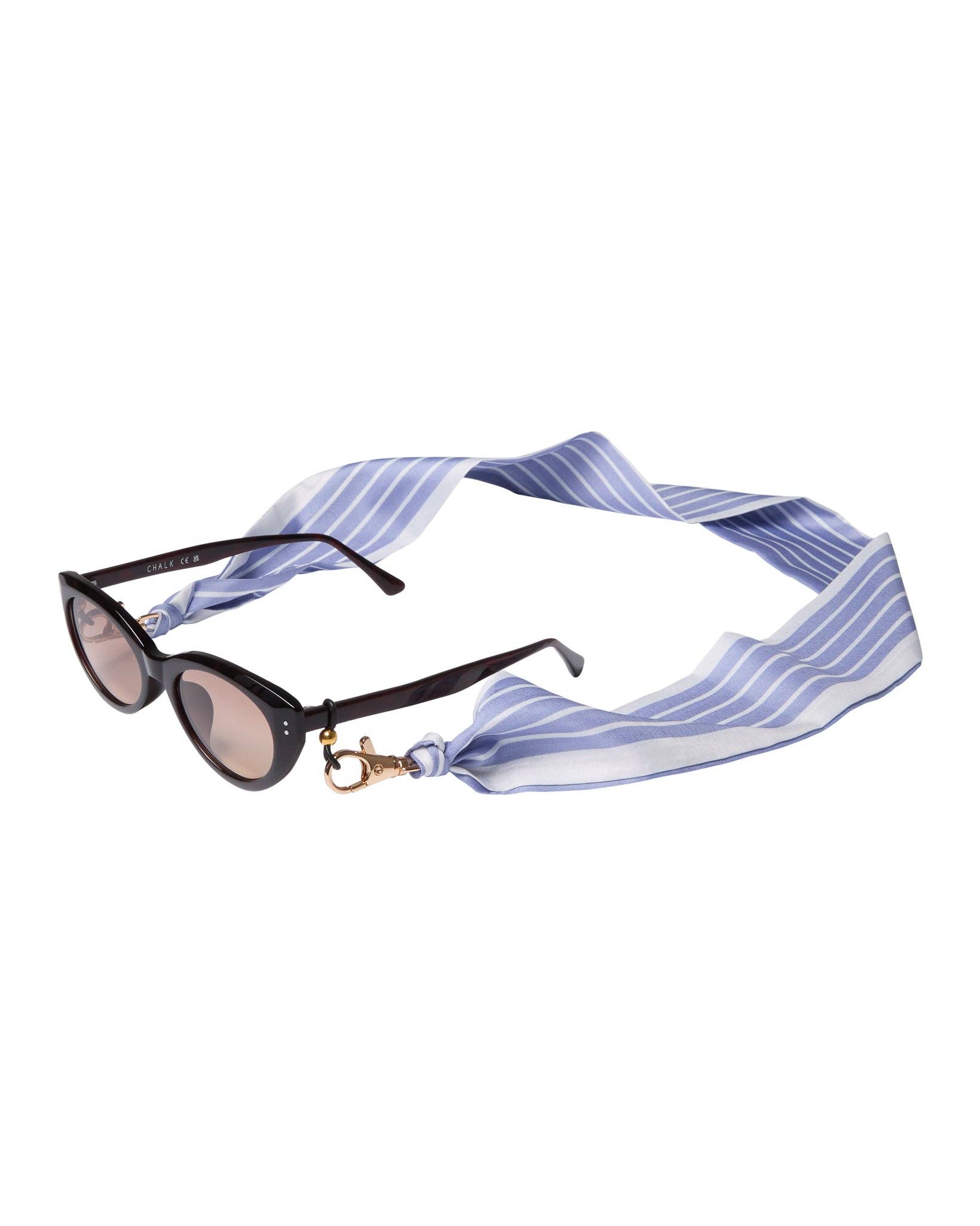 Sunglasses with a blue and white striped strap on a white background